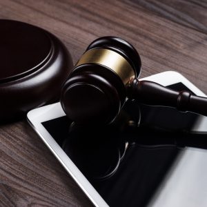 judge gavel and tablet computer on the table